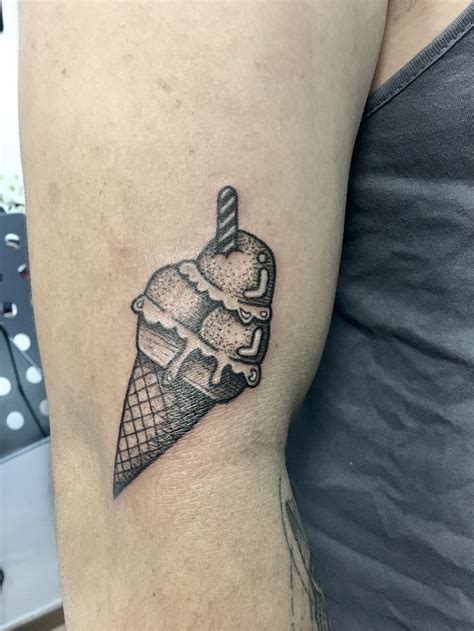 Ice cream tattoo done by Jon Koon at artistic studio hair and .